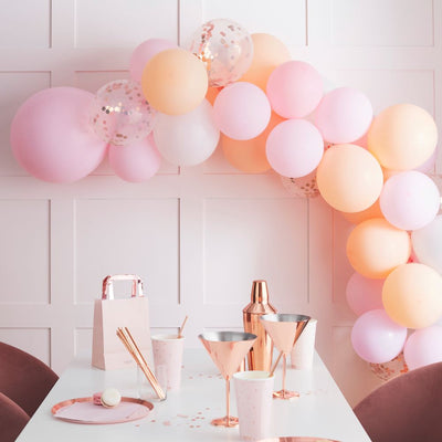 DIY Balloon Arch in rose gold confetti, peach, white and pale pink
